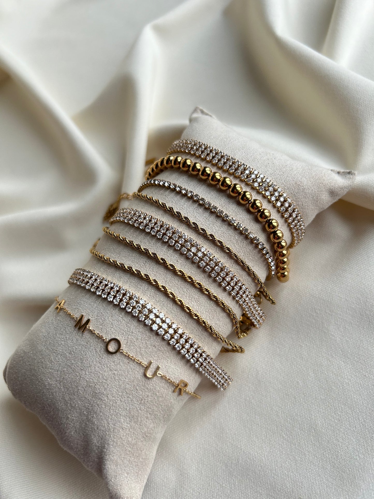 Teddy gevlochten armband goud