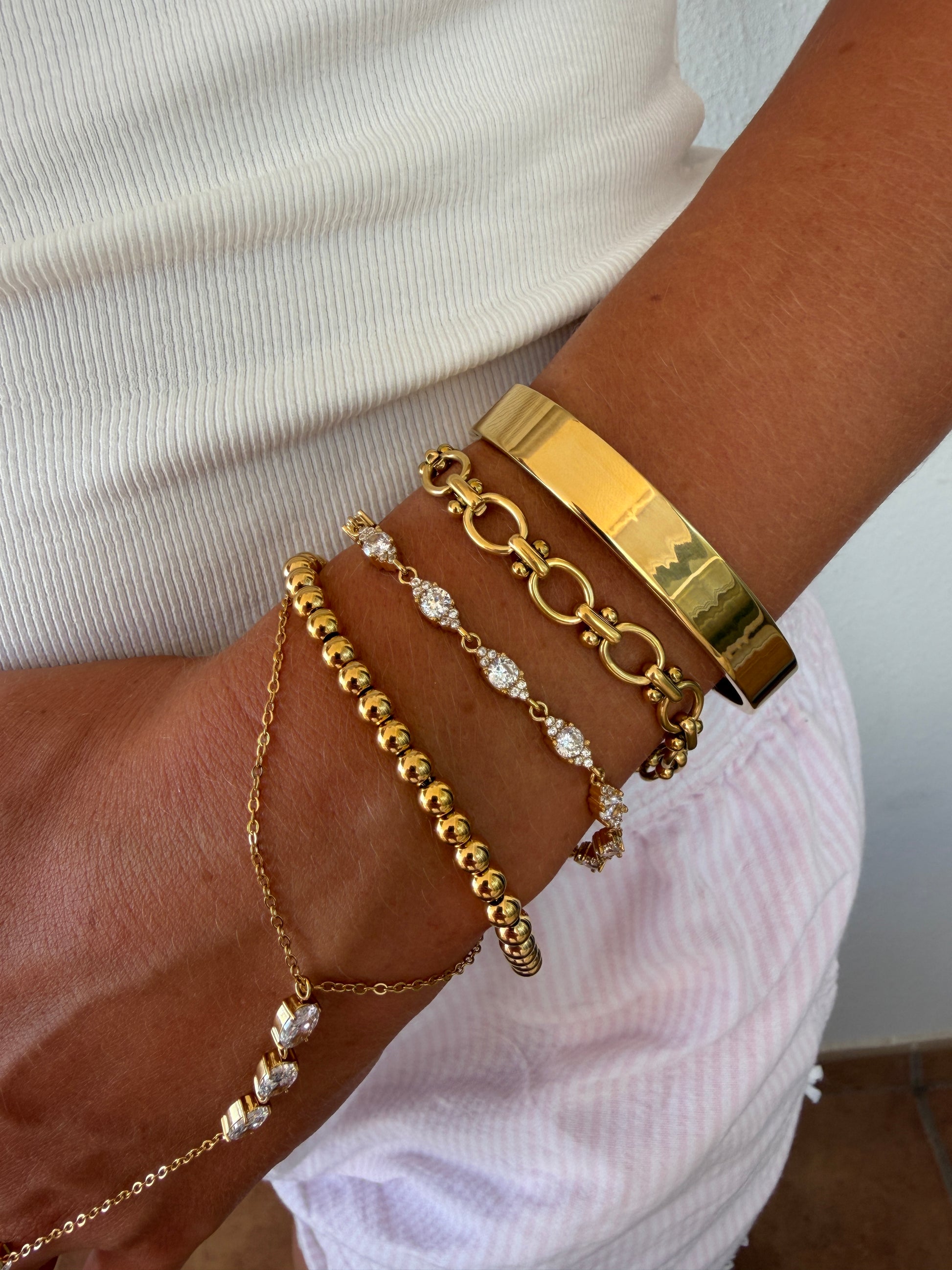 Brede bangle glans goud
